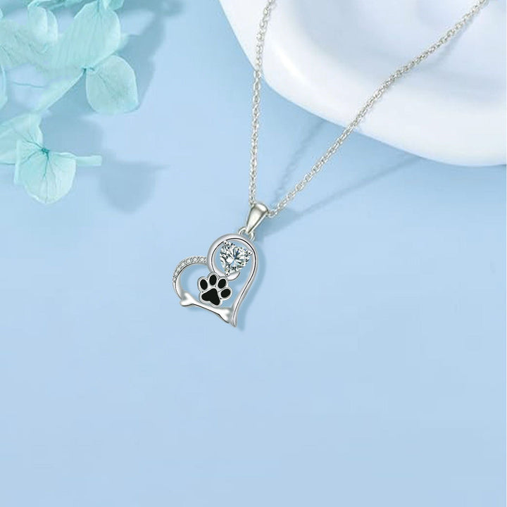 Collier en argent fait main avec empreinte de patte de chien et os en zirconium