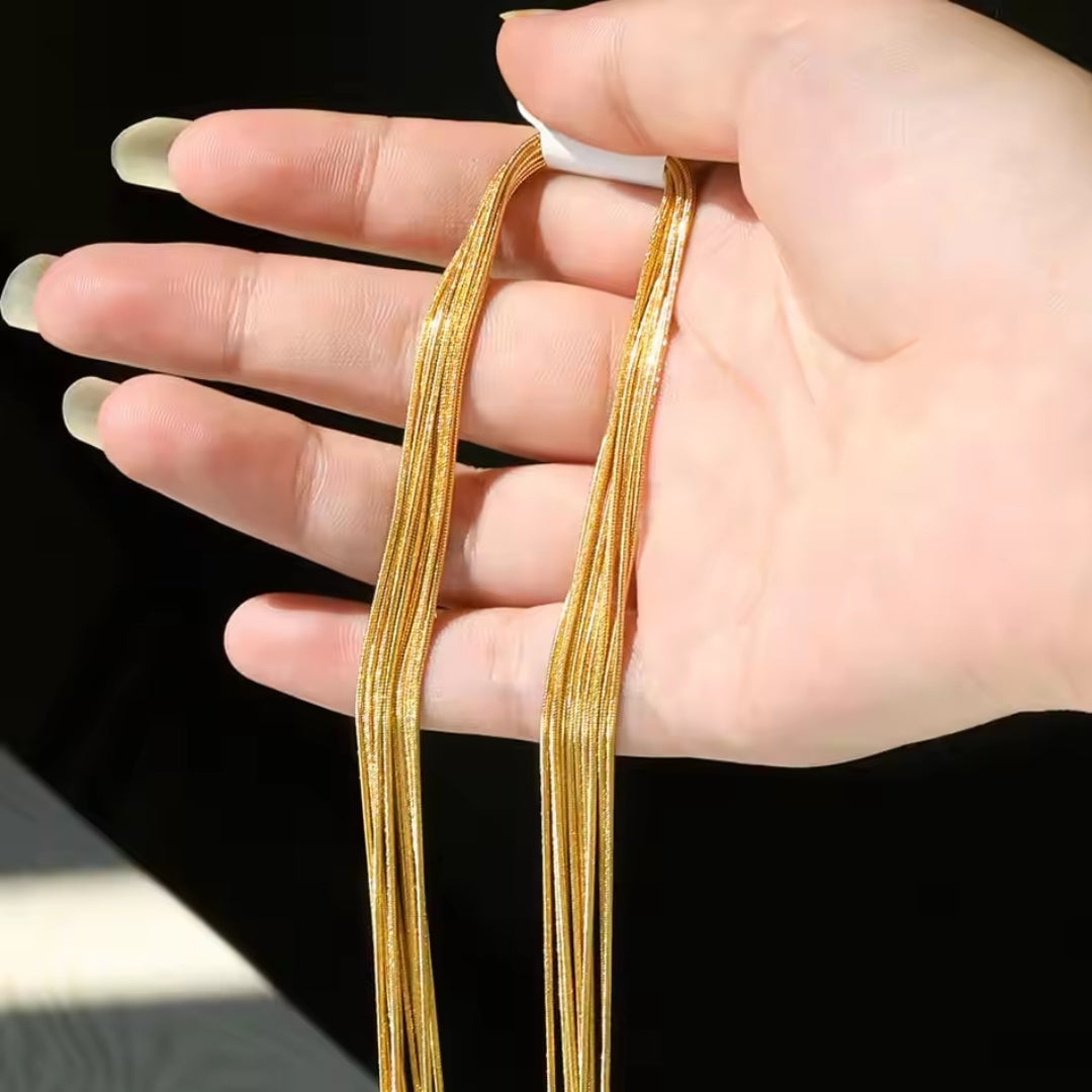 Boucles d'oreilles en maille dorée superposée