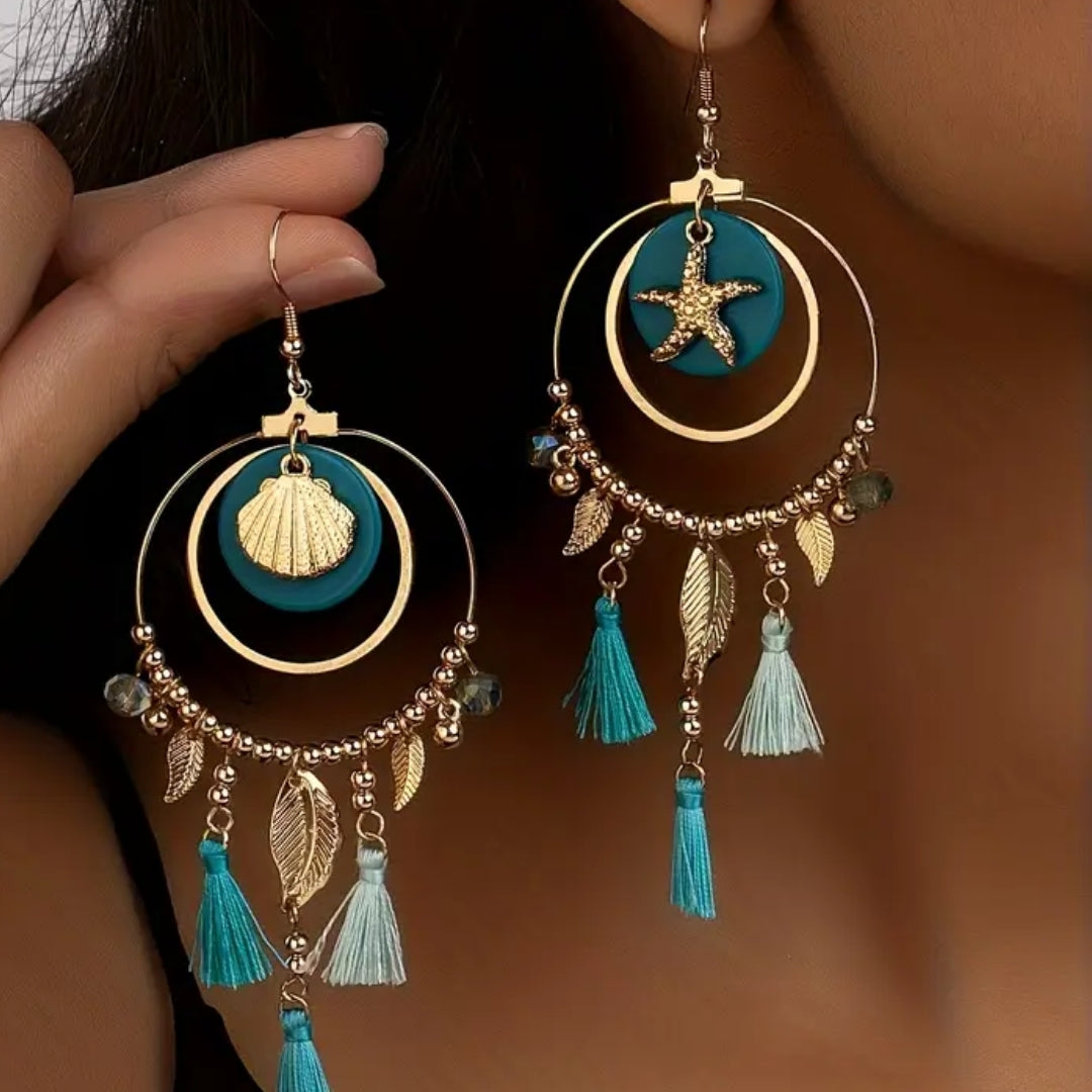 Boucles d'oreilles en or bleu suspendues en forme de mer