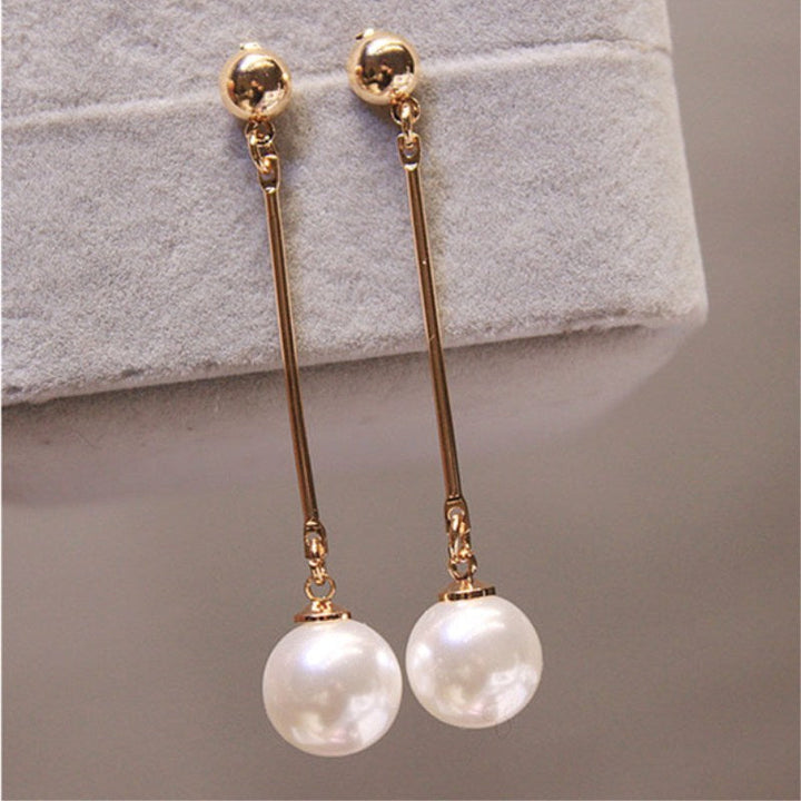 Boucles d'oreilles pendantes de luxe avec des perles plaquées à la main spéciales