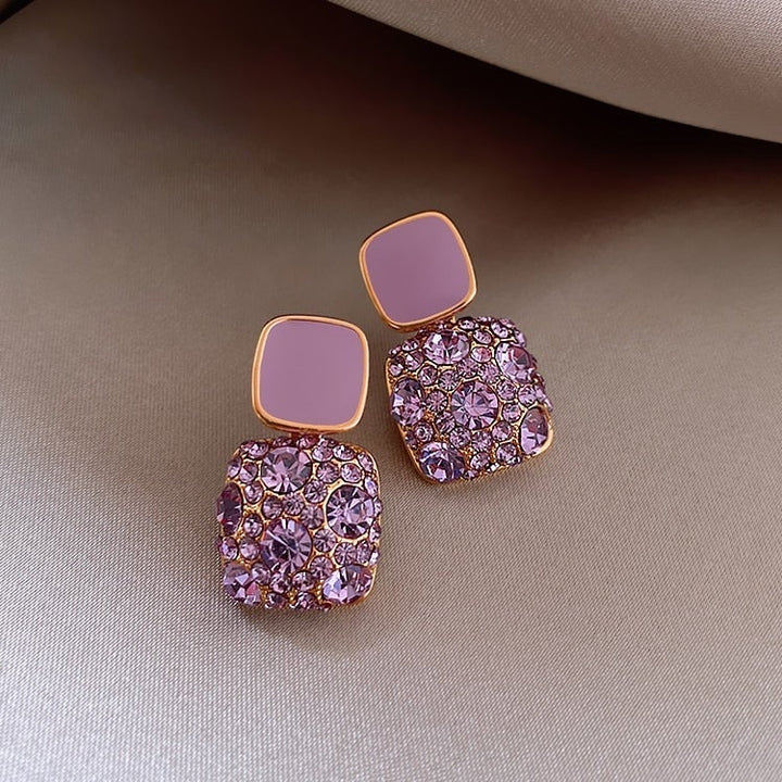 Boucles d'oreilles de luxe violettes avec incrustation de zirconia