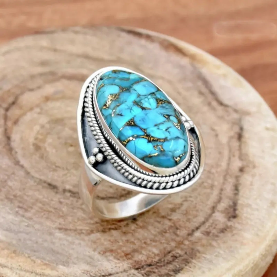 Bague en argent avec pierre ovale incrustée bleue