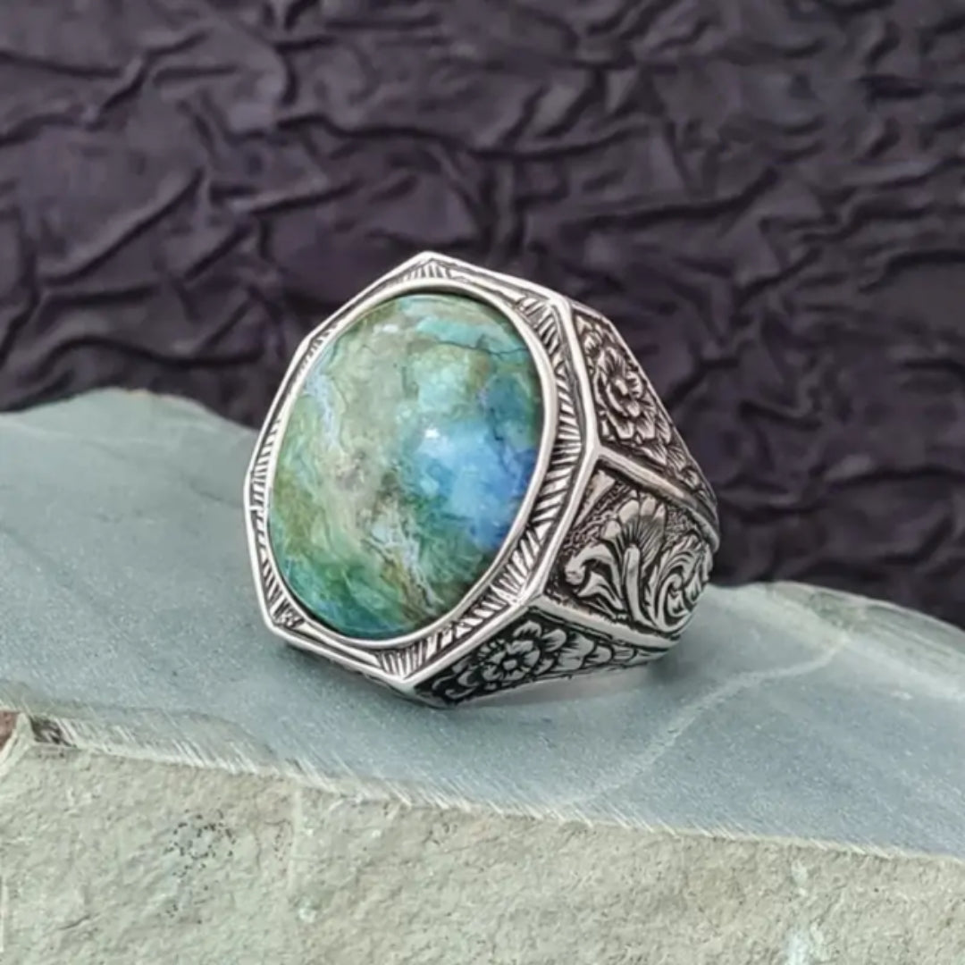 Bague en argent avec pierre ronde bleue