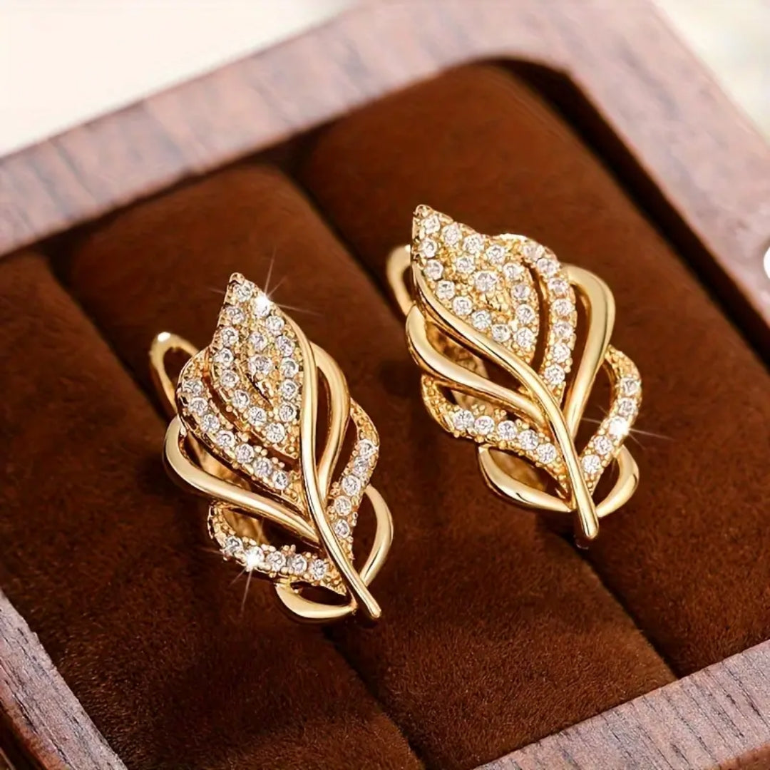 Boucles d'oreilles en feuille dorée étincelante