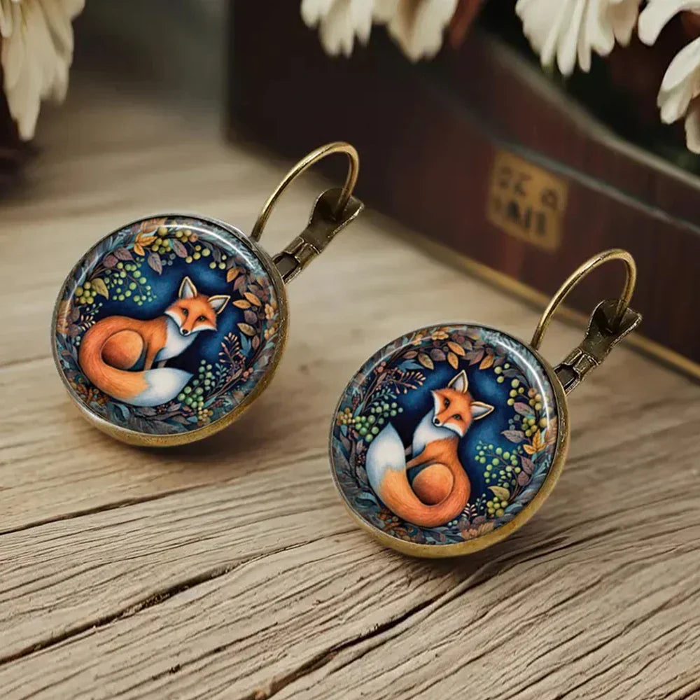 Boucles d'oreilles en verre sous dôme avec animaux fantaisistes
