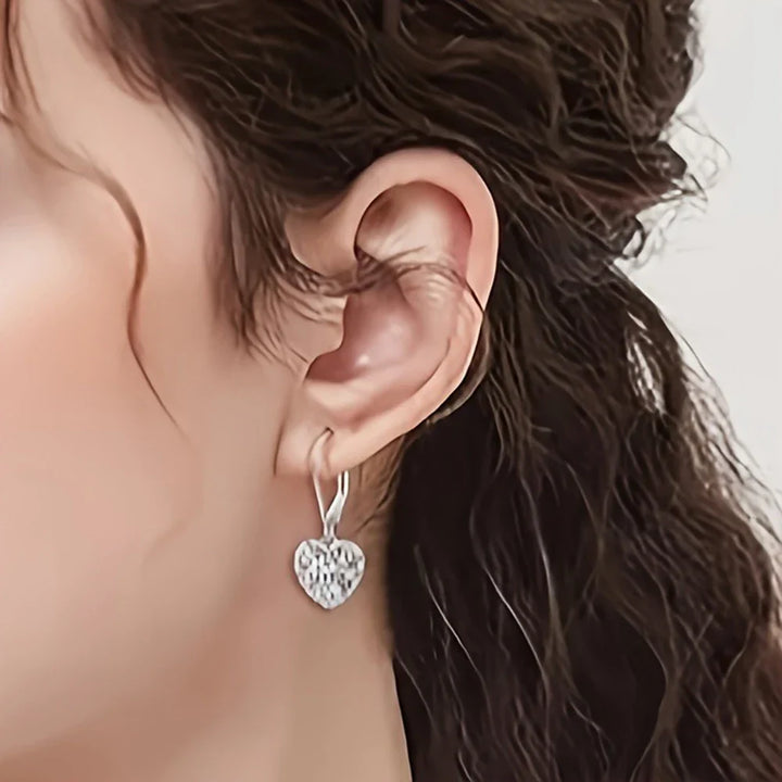 Boucles d'oreilles en forme de cœur creux argenté