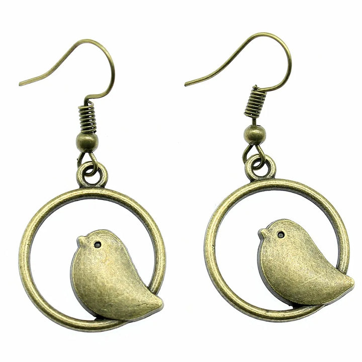 Boucles d'oreilles pendantes avec charme d'oiseau vintage – Bijoux boho faits main
