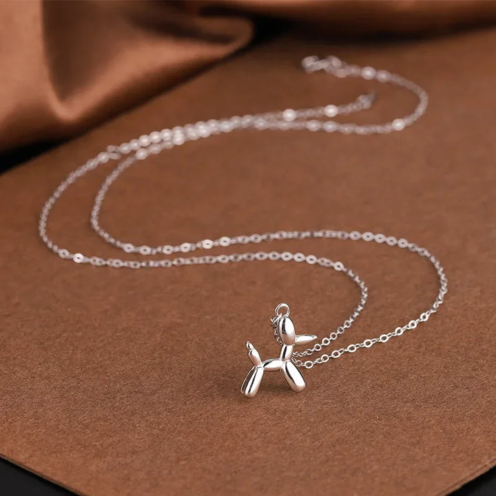 Pendentif en forme de chien en ballon doré