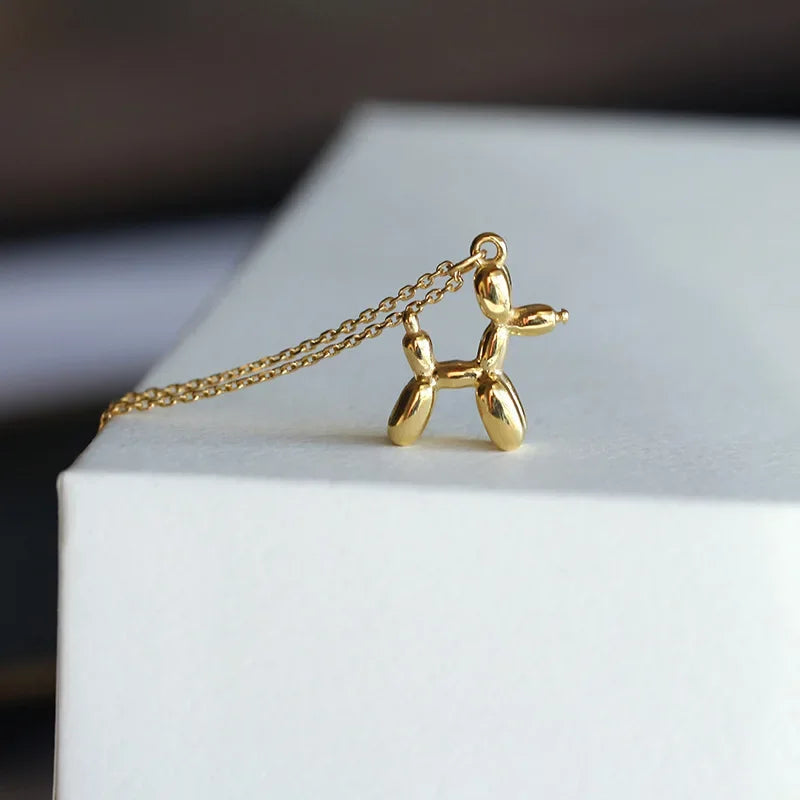 Pendentif en forme de chien en ballon doré