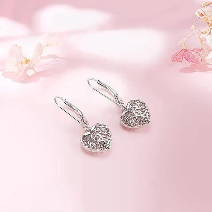 Boucles d'oreilles en forme de cœur creux argenté