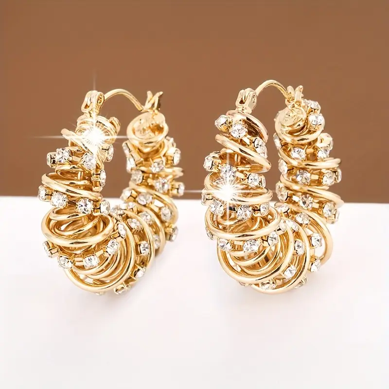 Boucles d'oreilles créoles en zirconia irrégulier doré