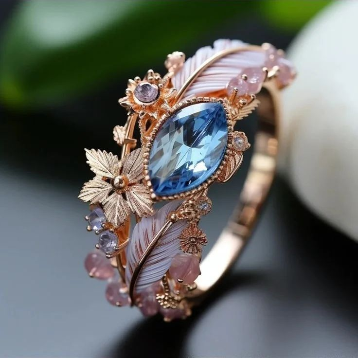 Bague en Cristal Bleu avec Plume Exotique