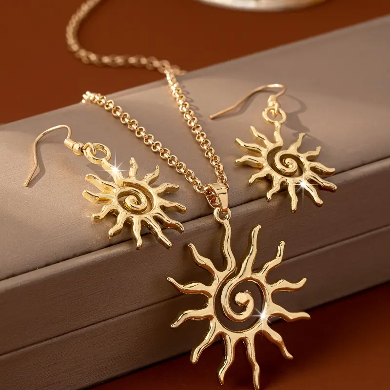 Boucles d'oreilles et collier en or solaire