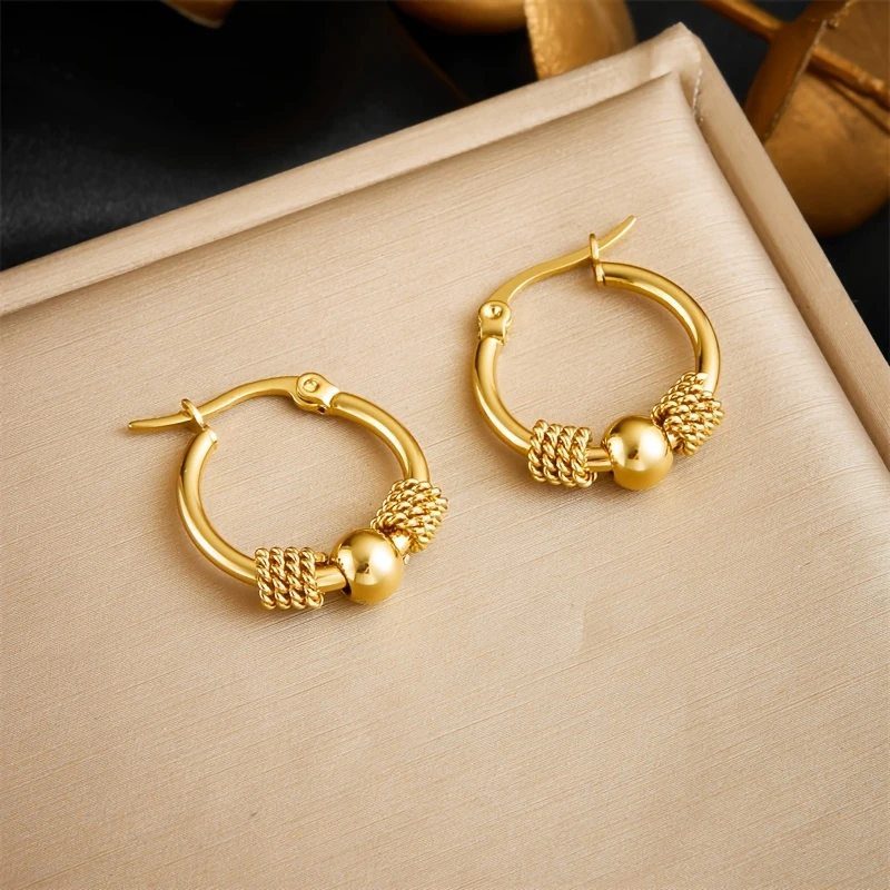 Boucles d'oreilles créoles en perles dorées