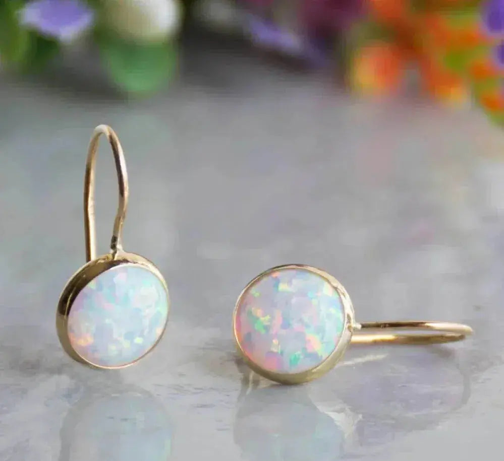 Boucles d'oreilles en or avec pierre opale vintage